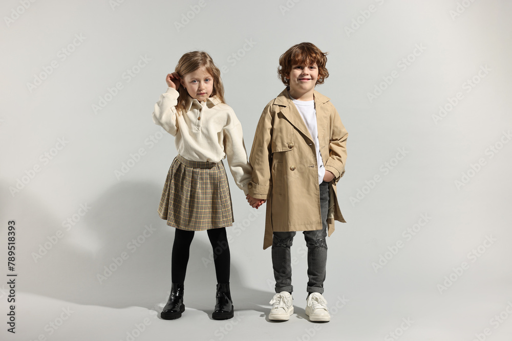 © New Africa - Fashion concept. Stylish children posing on light grey background