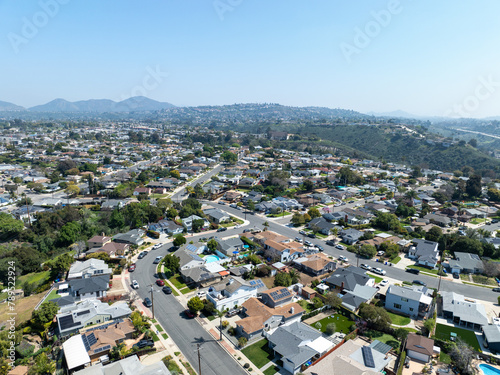 Fototapeta Naklejka Na Ścianę i Meble -  Aerial view of house with blue sky in suburb city in San Diego, California, USA.