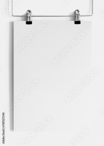 Png blank paper mockup hung with 2 clippers on white background