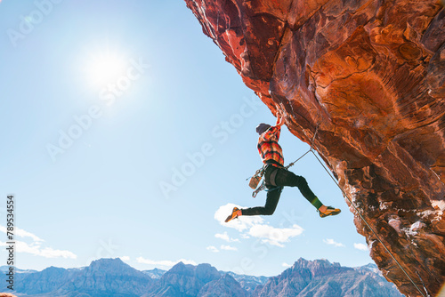 Man lead climbing outside photo