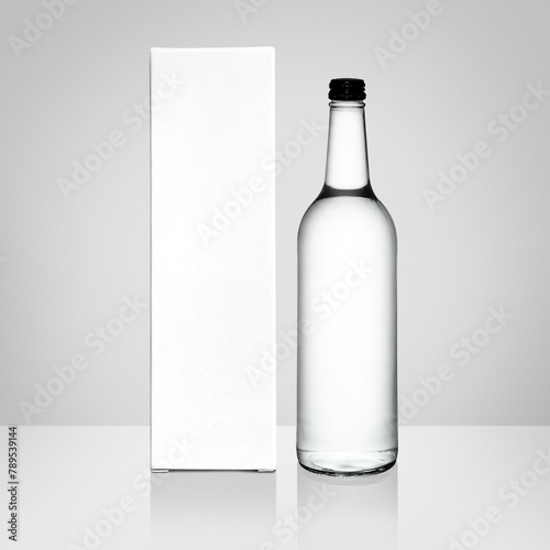 Glass bottle and box png transparent mockup on white backdrop