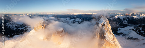 Sassolungo Mountains in the clouds Sella pass Italian Dolomites photo