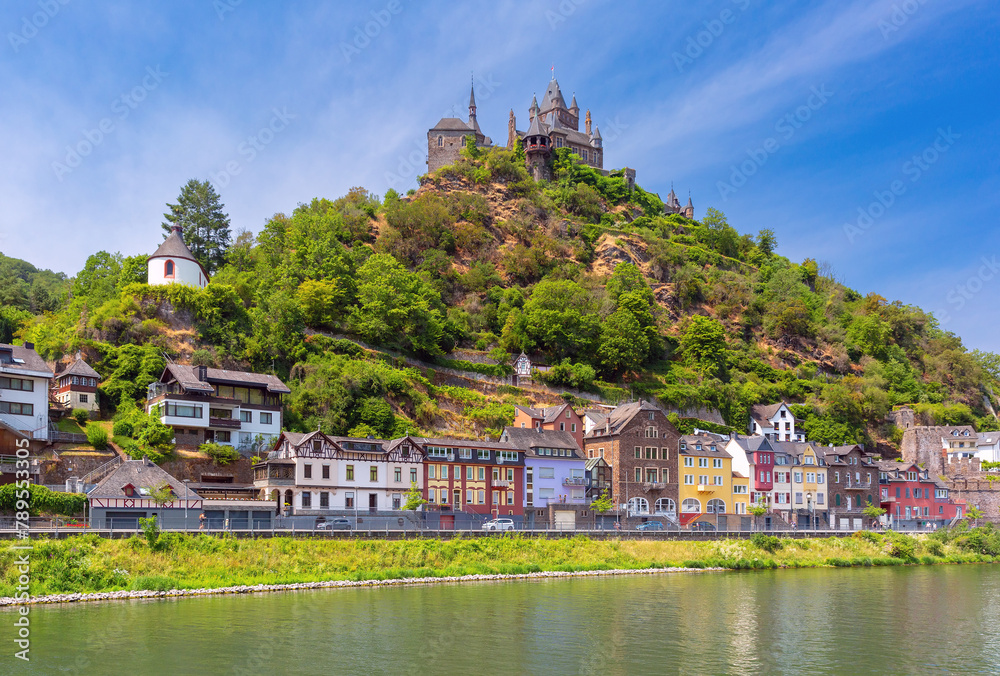 View of sunny Cochem with Reichsburg castle, beautiful town on romantic Moselle river, Germany View of sunny Cochem with Reichsburg castle, beautiful town on romantic Moselle river, Germany