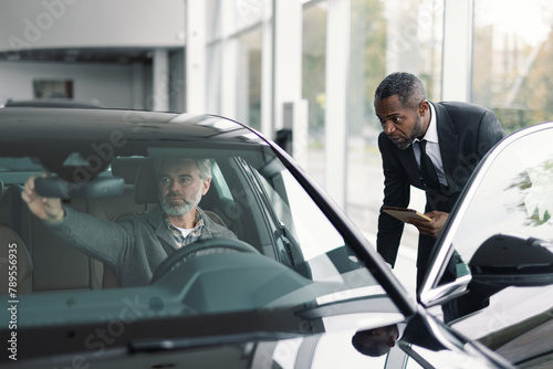 Serious customer test drive new vehicle dealership