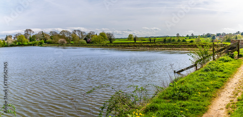 A view towards the dam wall on Welford Reservoir, UK on a bright spring day