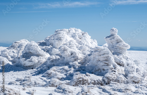Snow covered mountain. Landscape in The Serra da Estrela, the highest point of mainland Portugal, at 1993 metres altitude. photo