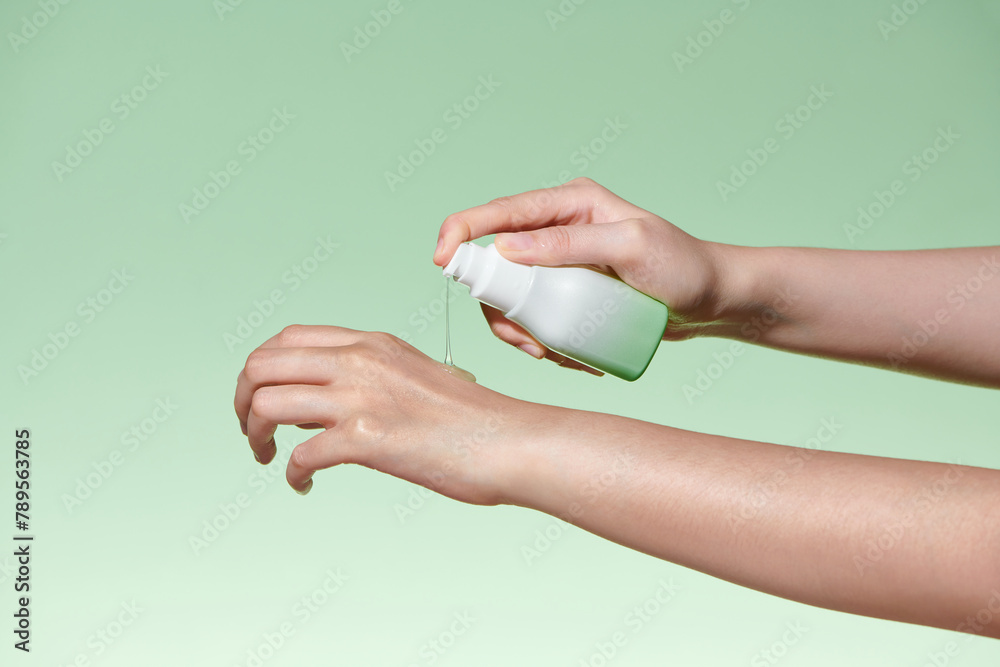 Push dispenser liquid facial fluid gel squeezed out to hand