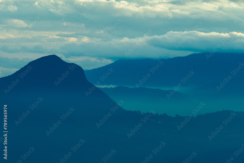 Blue panorama of the Andes Mountains from the Cerro las Nubes, Mount of the Clouds, in Jerico, Jericó, Antioquia, Colombia.