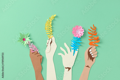 8th March. International Women's Day. Hands holding bunches of flowers photo