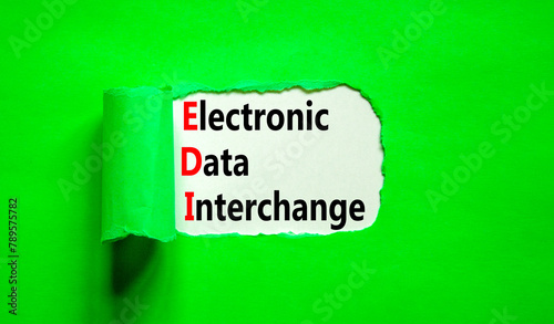 EDI electronic data interchange symbol. Concept words EDI electronic data interchange on white paper on a beautiful green background. Business and EDI electronic data interchange concept. Copy space.