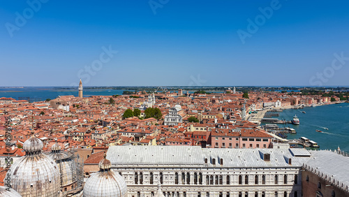 Aerial view from St Mark bell tower Campanile of the old town of Venice, Veneto, Italy, Europe. Looking at Piazza San Marco and Doge's palace. UNESCO World Heritage Site. Urban tourism in summer