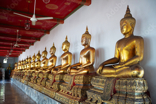 A row of Buddhist statues. photo