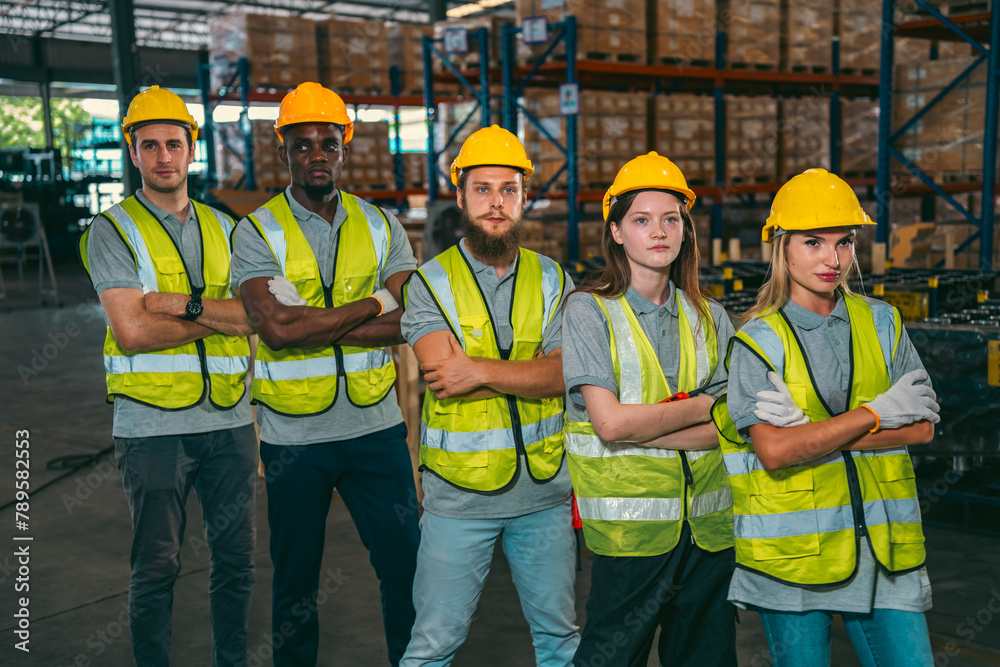 In a factory setting, a team of engineers and foremen emphasize safety and teamwork during a meeting, ensuring success in the construction industry. In a factory setting, a team of engineers and foremen emphasize safety and teamwork during a meeting, ensuring success in the construction industry.