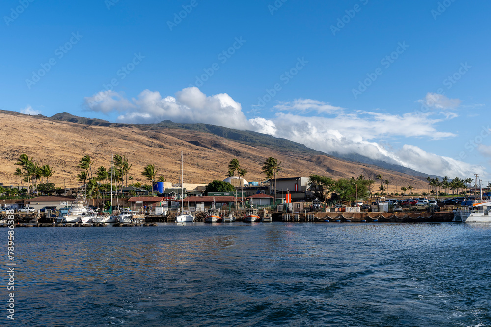 View of the shore from a boat on Maalaea Bay, which is on the southern coast of the isthmus separating West Maui from the island’s Central Valley View of the shore from a boat on Maalaea Bay, which is on the southern coast of the isthmus separating West Maui from the island’s Central Valley