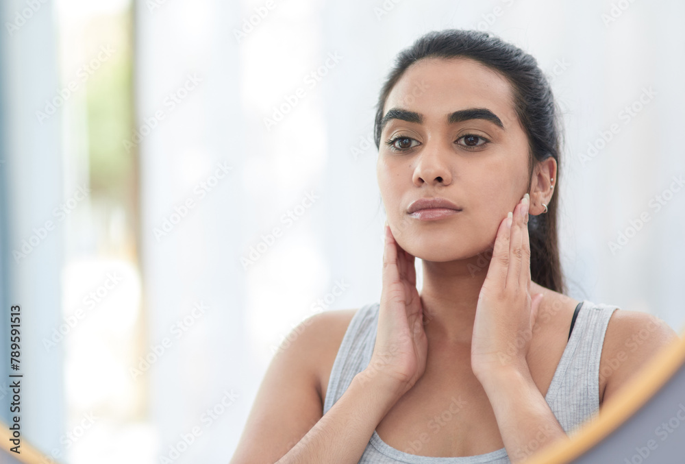 Face, skincare and reflection of woman in mirror of bathroom for aesthetic cosmetics or vitamin c. Beauty, collagen and dermatology with serious person in apartment for antiaging wellness routine Face, skincare and reflection of woman in mirror of bathroom for aesthetic cosmetics or vitamin c. Beauty, collagen and dermatology with serious person in apartment for antiaging wellness routine