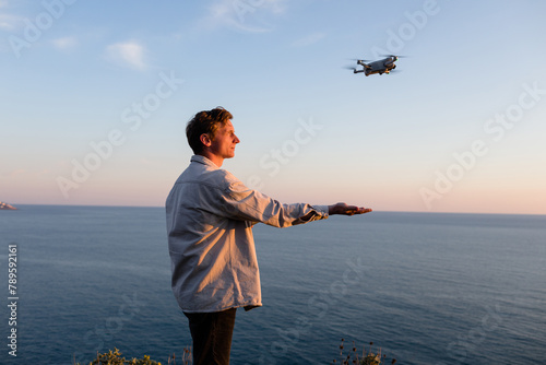 Man and quadcopter photo