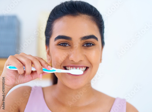 Portrait  woman and toothbrush for brushing teeth in bathroom  dental health and wellness with routine at home. Oral hygiene  orthodontics and fresh breath with morning self care and tooth whitening