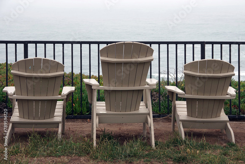 Adirondack chairs on a foggy day on the California coas photo