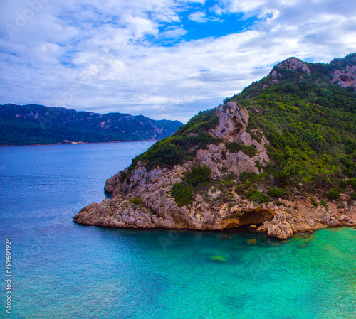 fantastic morning view on pebble beach Ampelaki near Paleokastritsa monastery and Agios Pavlos beach, Corfu island, Europe ...exclusive - this image is sold only Adobe stock		 photo