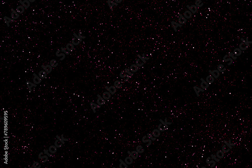 Starry night sky. Galaxy space background. Colourful night sky with glowing stars. Purple violet magenta pink red dark night with shiny stars. New Year  Christmas and Celebration backdrop concepts.