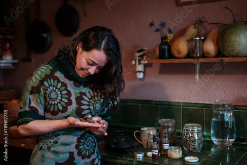 Woman making natural medicinal preparations photo