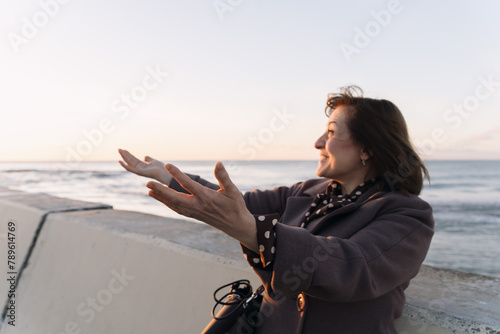 Woman Standing By The Sea photo
