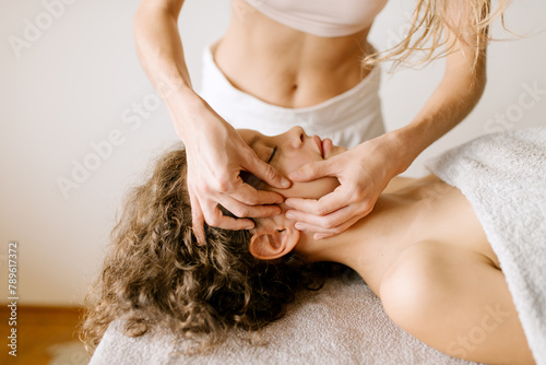Therapist Doing Facial Massage photo