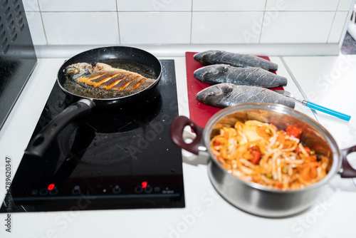 Cooking fish in a pan. photo