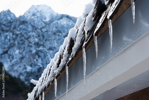 Icicles hanging from the eaves photo
