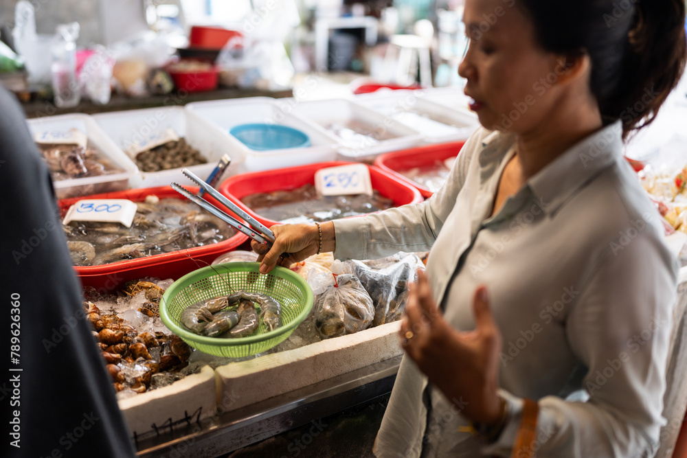 Woman at Thai food market. Woman at Thai food market.