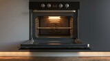 The image shows a clean and modern oven. The oven is black and has a sleek design. The oven is open and the light is on.