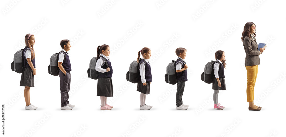 Obraz premium Full length profile shot of teacher and schoolchildren waiting in line