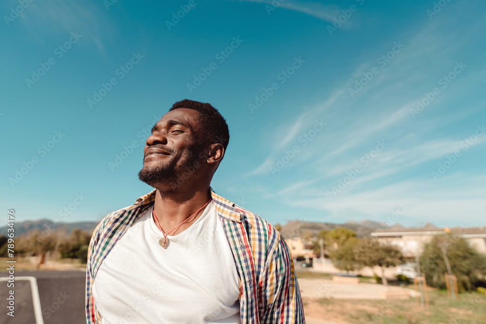 Satisfied and hopeful young black man portrait Satisfied and hopeful young black man portrait