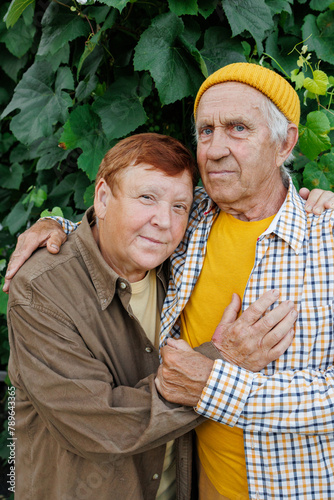 Elderly couple of man and woman in a tight embrace 