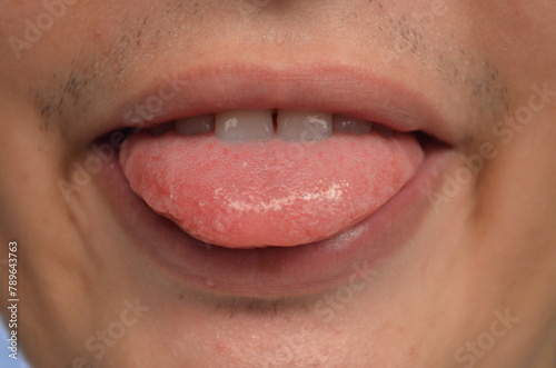 Mężczyzna pokazuje język, The man shows his tongue