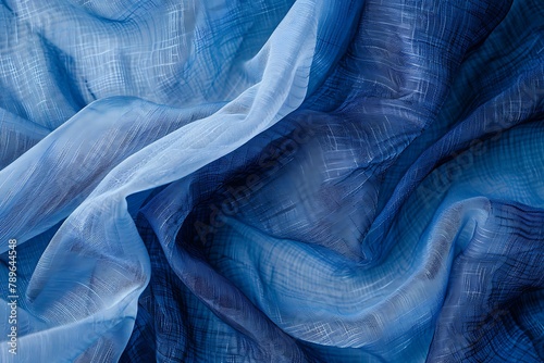 Fabric texture with fine mesh, dark and light shades of blue and light blue. .