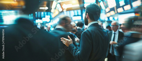Crowded stock exchange floor with traders making gestures and communicating with each other. © Szalai