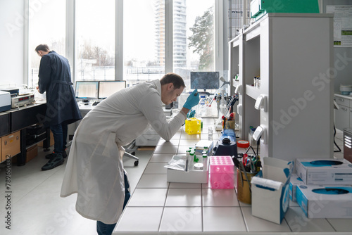 Researchers Working In Bright Lab Room photo