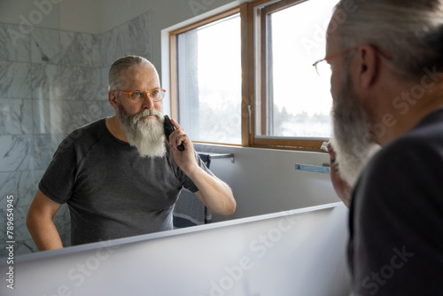 Man Combing Beard photo