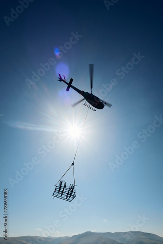Helicopter transports bicycles photo
