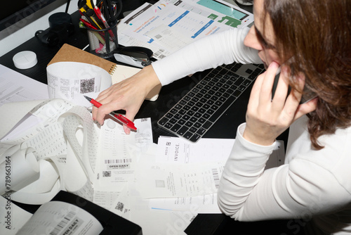 Phone call while reviewing business receipts photo