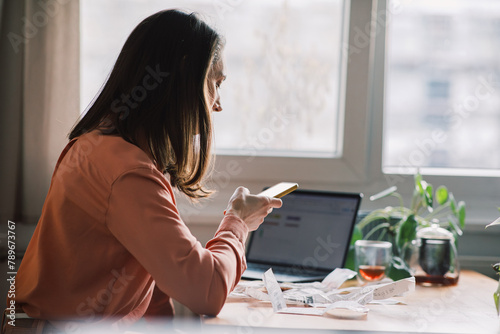 Woman Calculating Costs and Budgeting