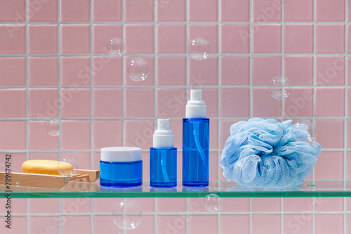 Cosmetic product display on mosaic bathroom with skincare items
