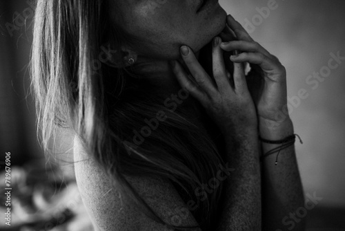 Close Up photo of Ginger female with many freckles on the hand photo