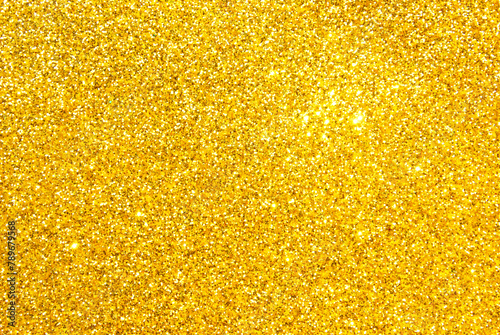 Golden sparkle glitter texture as background
