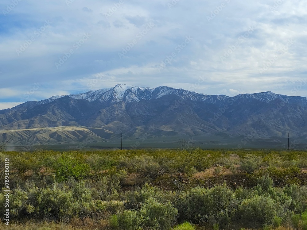 Fototapeta premium Snow tipped Arizona mountains in a rural valley wilderness