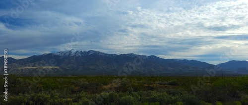 Snow tipped Arizona mountains in a rural valley wilderness © Joe