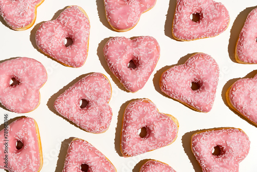 Heart-shaped donuts with pink icing. Valentine's day.  photo