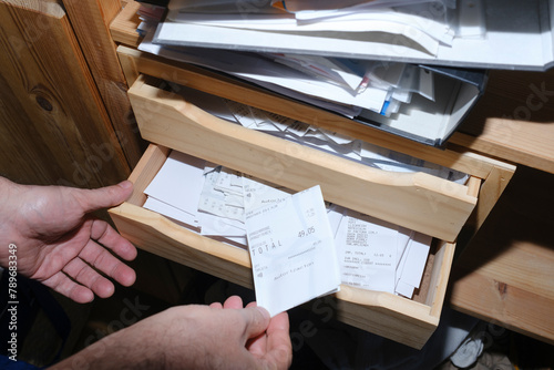 Man organizing receipts for his business accountability photo