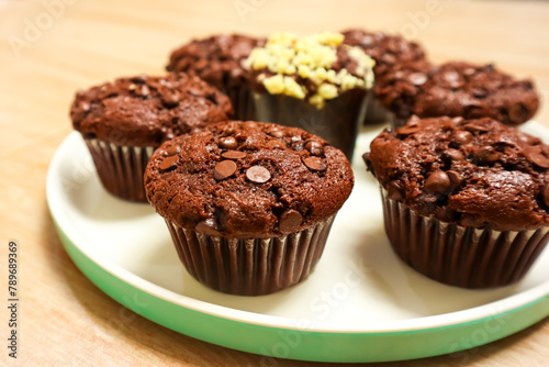 Chocolate muffin or cupcake with chocochips topping
